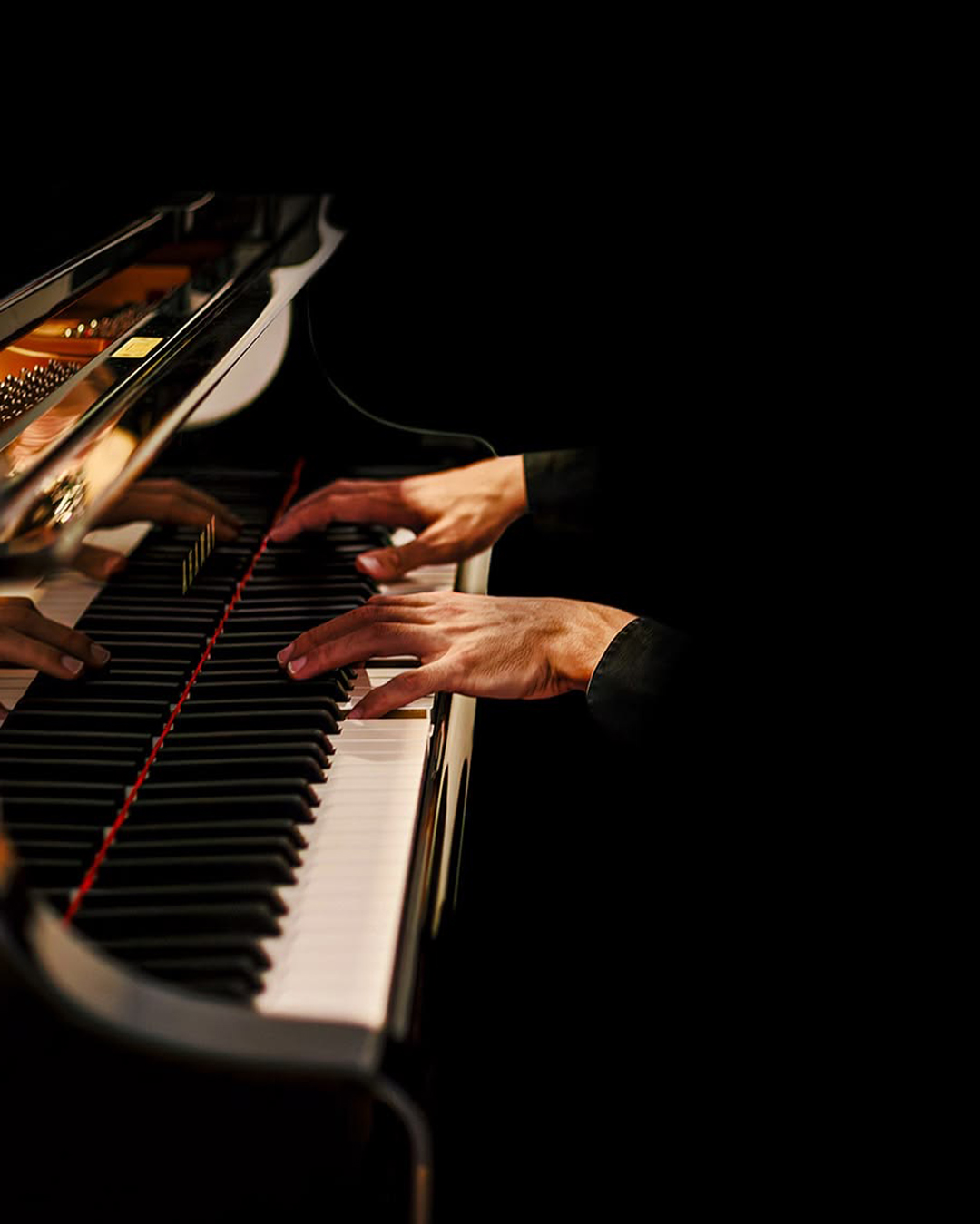 Adam Gravelle performing live at the piano